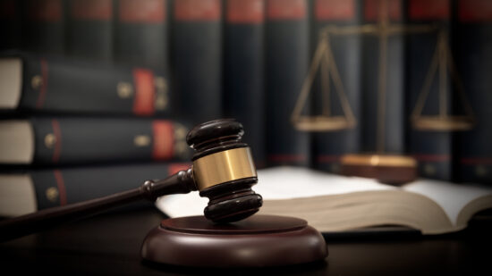 Judge gavel and scale in court. Legal concept